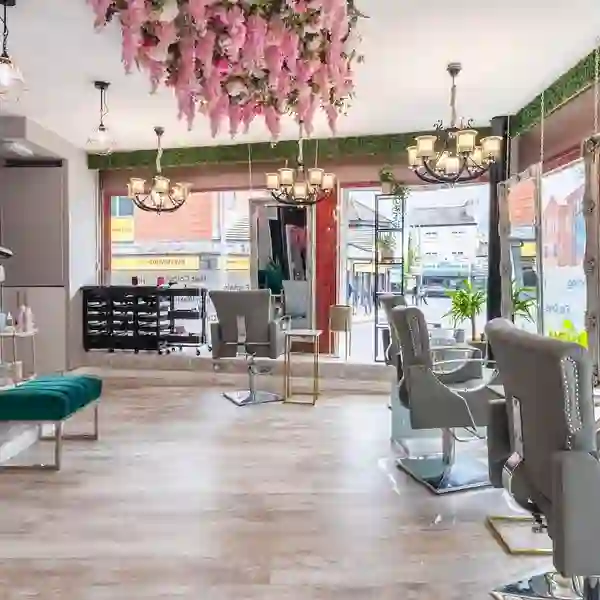 Radiance Glamour Lounge salon floor with floral ceiling and emerald seating