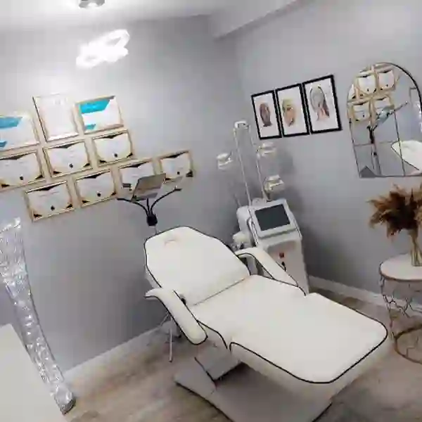 Aesthetics clinic treatment room with certificates