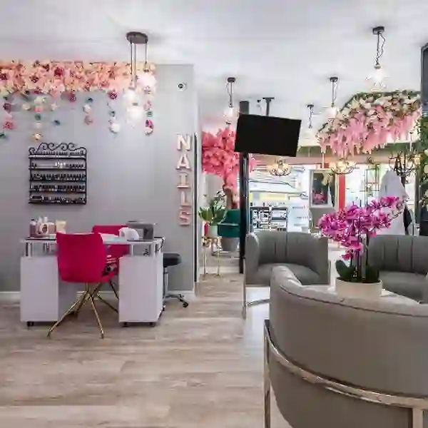 Nail and lounge area with floral wall
